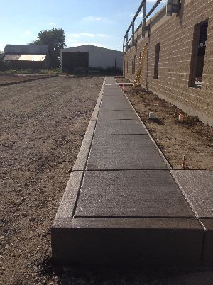 Stamper Concrete works with commercial and city sidewalk work.